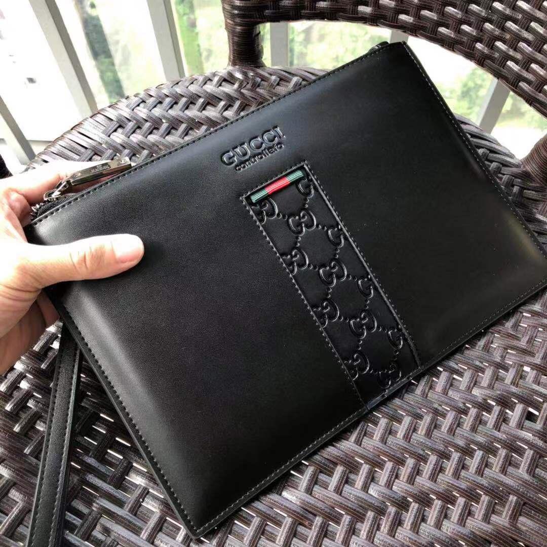 Ví nam Gucci siêu cấp cầm tay da trơn họa tiết logo ở giữa