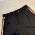 Quần short Gucci siêu cấp đen viền nâu 2 bên QSG2118