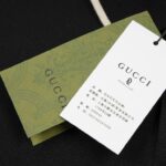 Áo Polo nam Gucci màu đen họa tiết tag đỏ