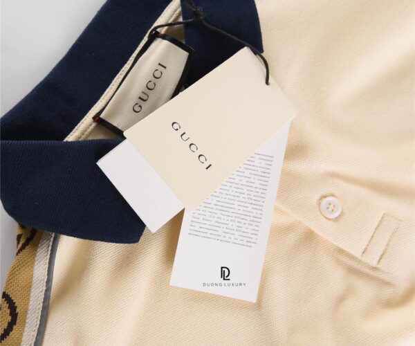 Áo Polo Gucci Interlocking màu kem logo dập tay áo