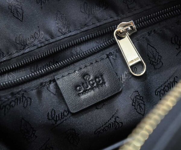 Túi đeo chéo nam Gucci siêu cấp màu đen tag chéo logo vàng