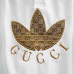 Áo Polo Gucci x Adidas màu trắng họa tiết hoa vàng Like Auth